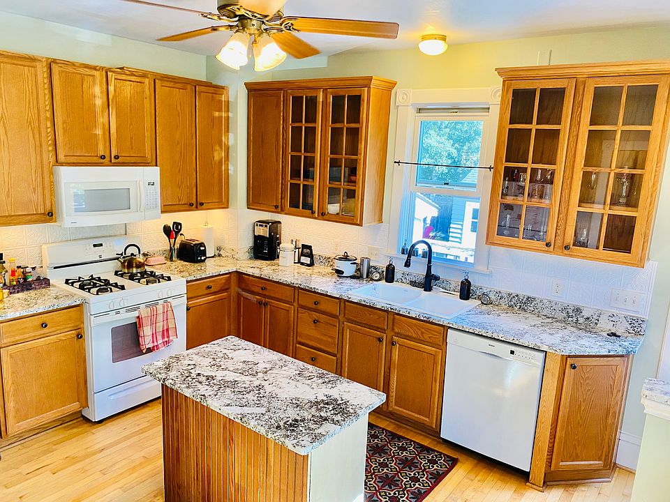 Kitchen with granite countertops and island