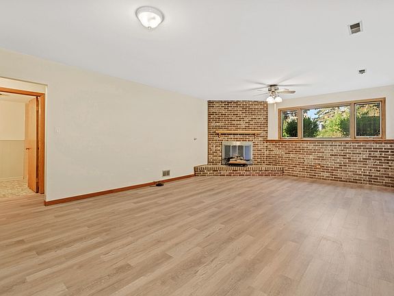 Fireplace, views of backyard, storage closet, full bathroom.