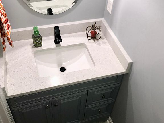 First floor powder room with quartz countertops