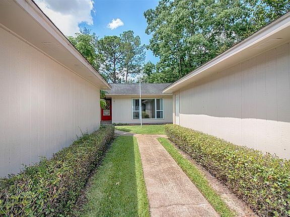 The walkway lined with fantastic landscaping leads to the front door.