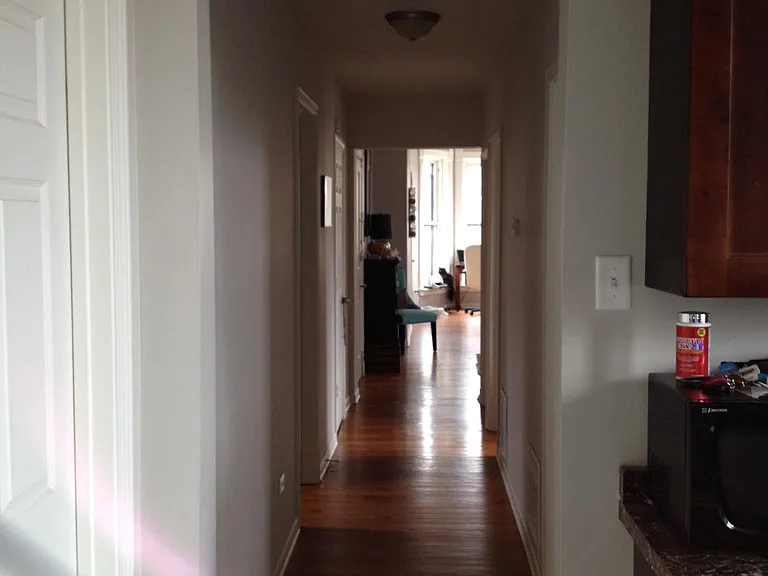 This is the hallway of a different apartment to demonstrate what the area may look like if the dividing wall was removed.