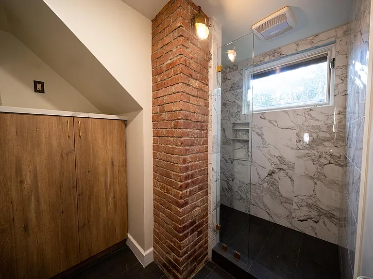 1st floor bathroom showing storage cabinet
