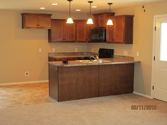 View of kitchen from front room. Open main area of house for entertaining.