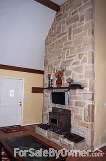 Floor to ceiling stone fireplace
						:
						wood/coal insert