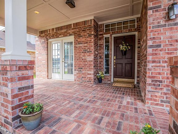 You'll spend many happy days on this porch watching the kids play in the cul-de-sac.