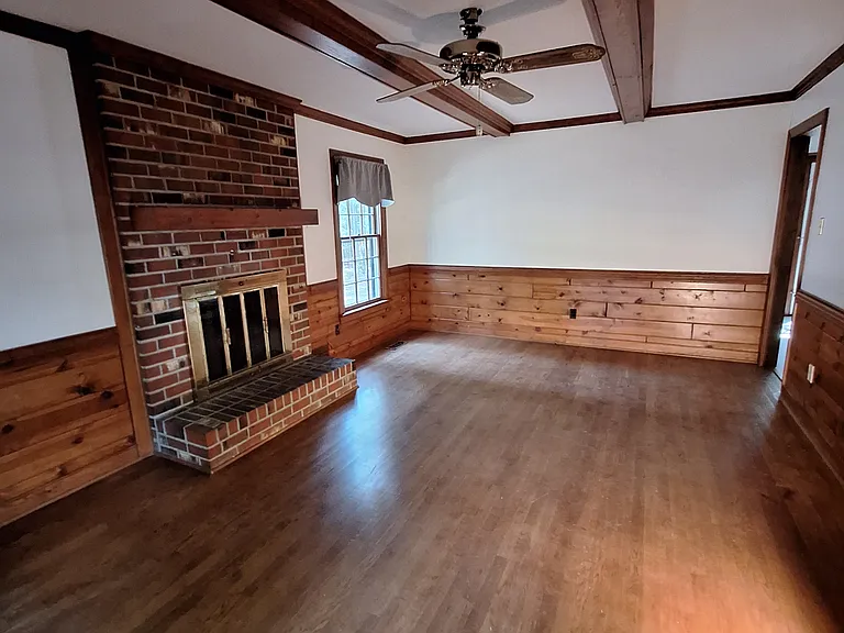 Family room with beamed ceiling