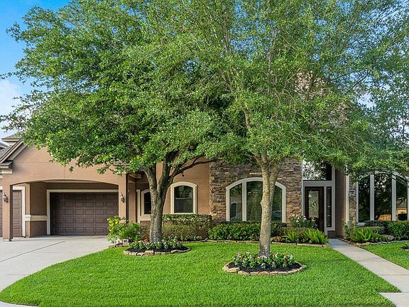 Curb appeal! Professional landscaping, sprinkler systems, 3 car garage and mature trees!