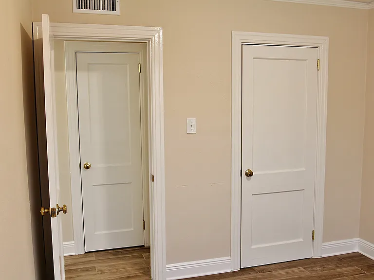 This again is a picture of the sister apartment... just picture this master bedroom with gorgeous hardwood oak flooring. This is looking toward bedroom door, at the closet doors, and hallway.