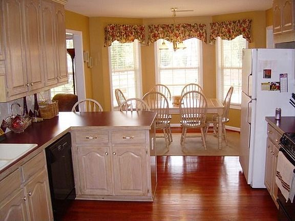 Breakfast room overlooks deck and fenced back