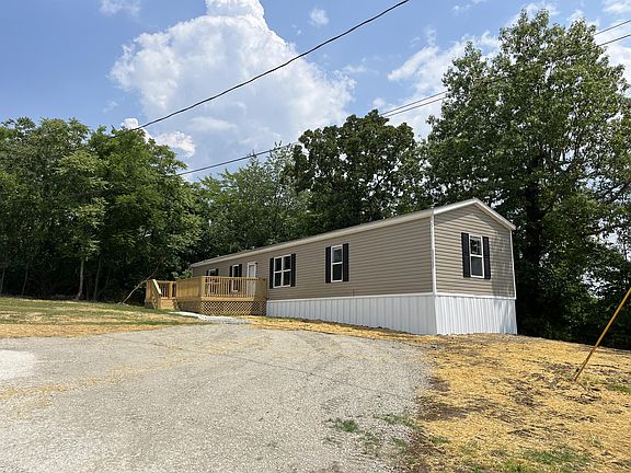 Exterior with driveway. Interior photos will be available shortly
