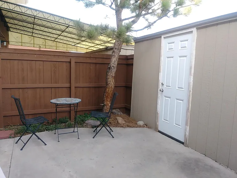 Private, Fenced-In Back Patio With Large Storage Shed