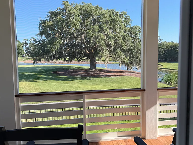 Outstanding views of the Grand Oak, lagoon, golf course facing south