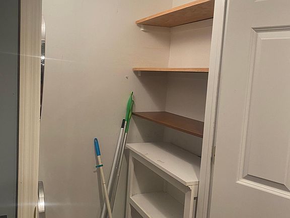 Laundry room with Washer Dryer and small pantry or extra space.