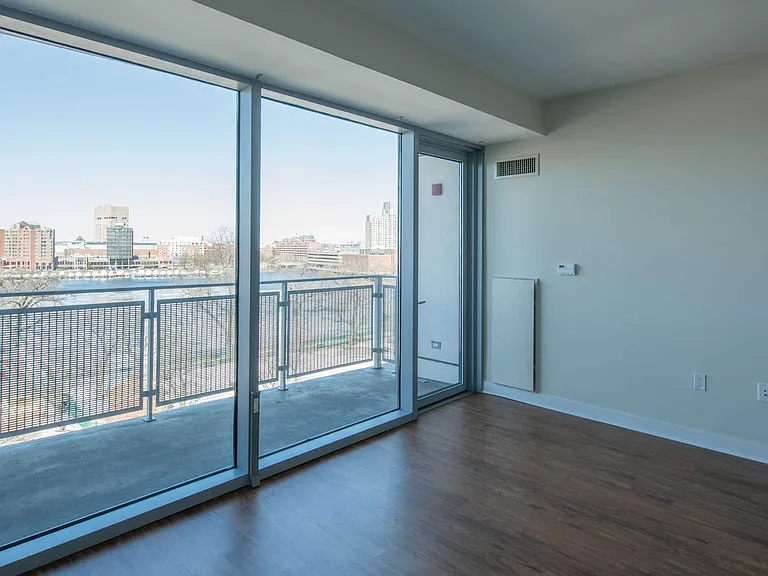 Vesta Living Room with Floor-to-Ceiling Windows and Balcony
