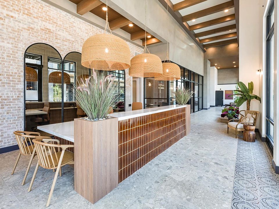 A warm welcome starts here_our leasing lounge blends modern textures with desert-inspired design for a fresh take on hospitality.