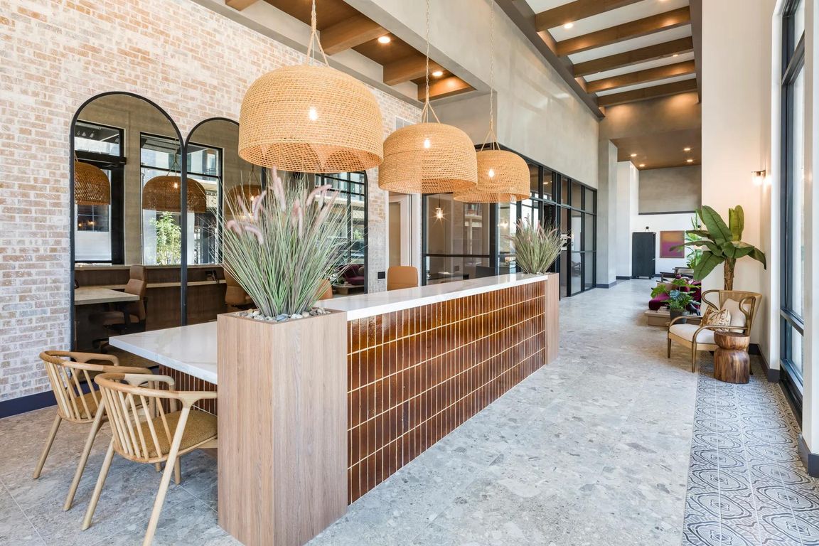 A warm welcome starts here_our leasing lounge blends modern textures with desert-inspired design for a fresh take on hospitality.