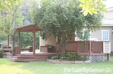 Large covered Deck with 2 ceiling fans.
						:
						Entertaining outside this deck is a great addition.