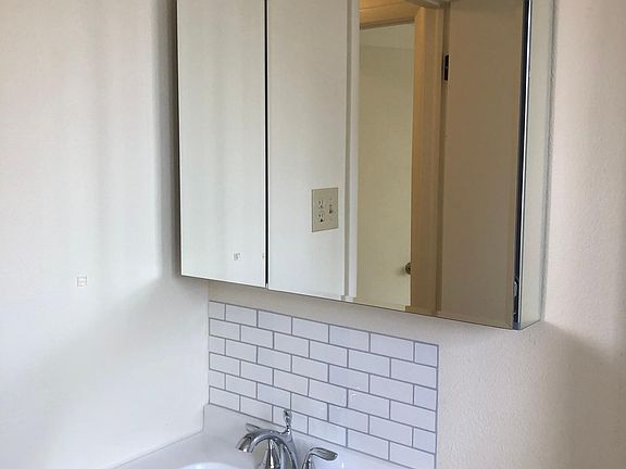 New sink, vanity, light fixture, faucet and storage mirror