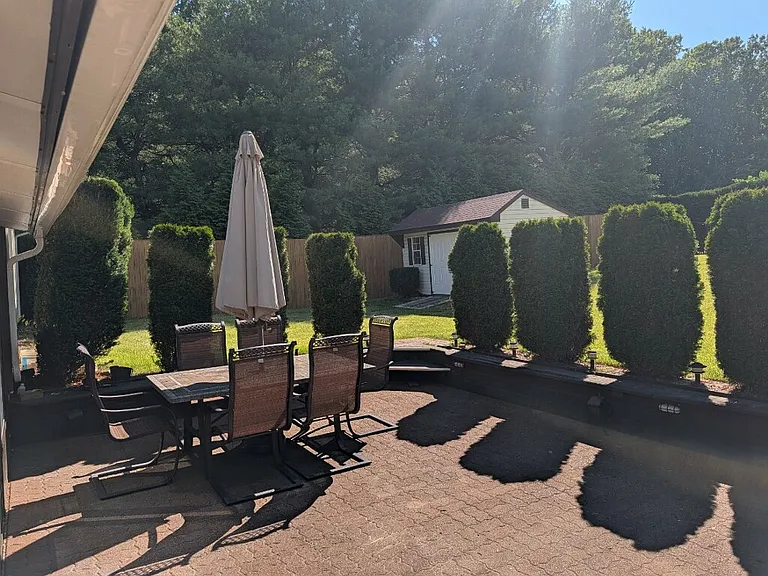 Patio off of Sunroom. Has patio furniture included in rental!