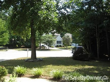 Front Porch View : Covered front porch supported by Roman Columns.
