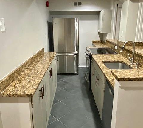 Kitchen with granite countertops and stainless steel appliances