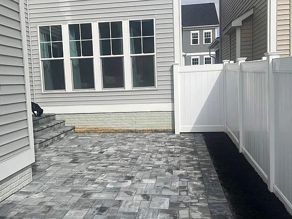 Rear of Home w/ Finished Stone Patio