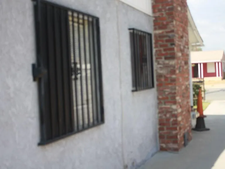 The house has bars on windows with emergency exit locks smok