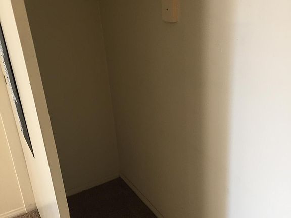 Inside three door closet plenty of closet space for clothing, and for coats. Shelf for sweaters. Great storage space for luggage and more.