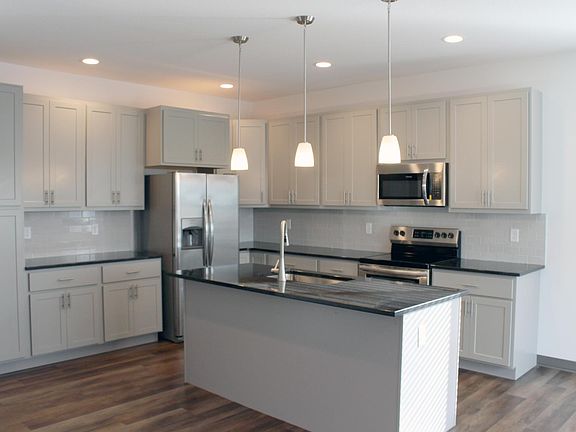 18 feet of granite countertops, 13 upper and lower cabinets and a floor to ceiling pantry cabinet.