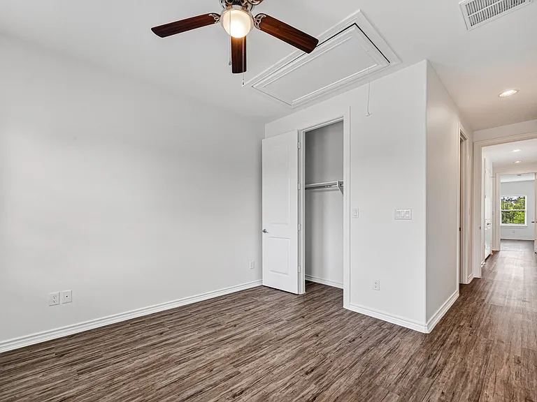 Second bedroom featuring its own private full bathroom.