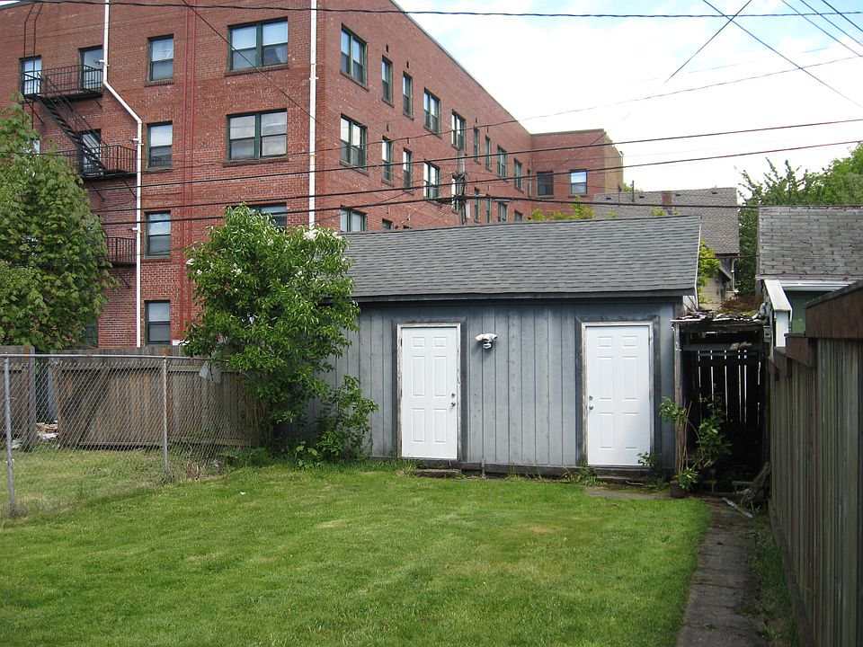 Fenced backyard and garage. Each unit has a one-car garage.