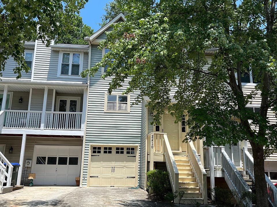 half the drive-way belongs to the green townhouse