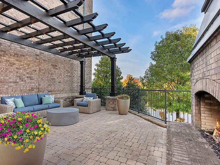 Relax and unwind by the outdoor fireplace