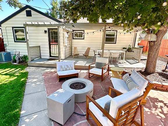 Fully fenced backyard with paver patio and deck