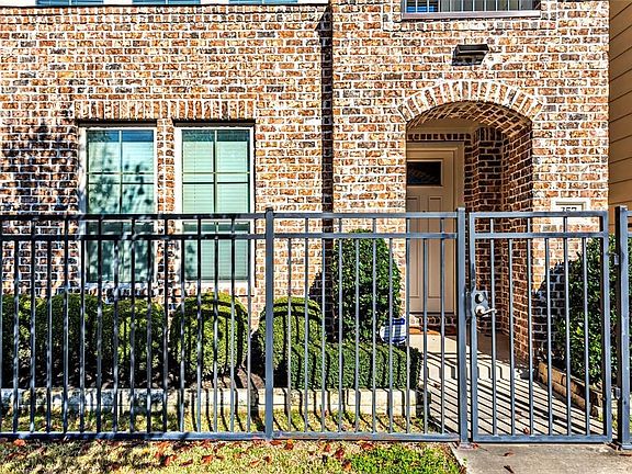 Gated front yard is easy care. HOA takes care of the lawn and landscaping for you.