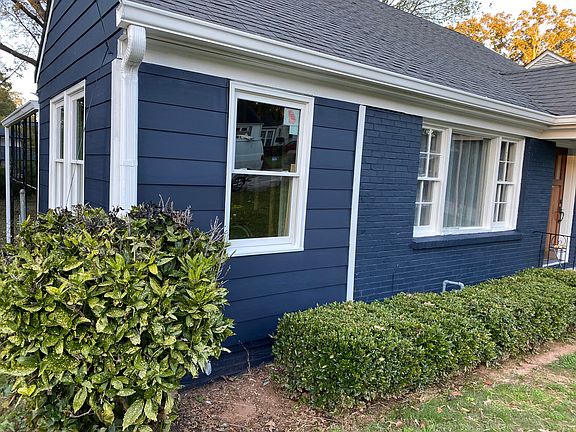 The house faces south, this is the left (west) side.