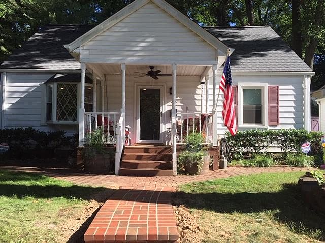 Nice front porch with ceiling fan for a cool breeze on a warm afternoon