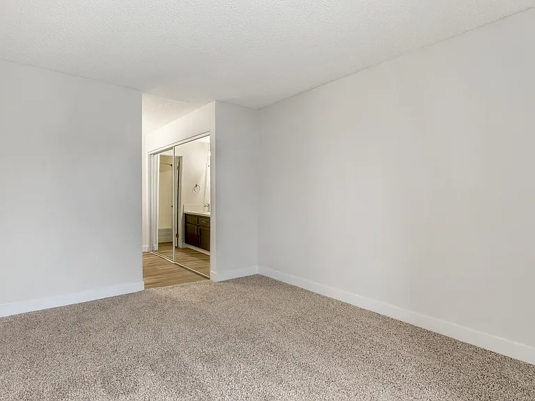 Modern comfort meets timeless elegance. Step into serenity with our updated bedrooms, featuring pristine white walls and plush new carpeting.