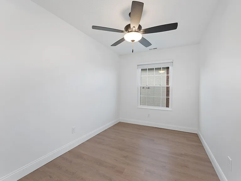 Step into this airy, modern room featuring sleek hardwood floors and stylish lighting. Step into this airy, modern room featuring sleek hardwood floors and stylish lighting.