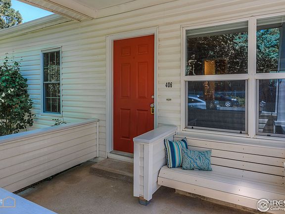 Covered patio with built in bench by the front door
