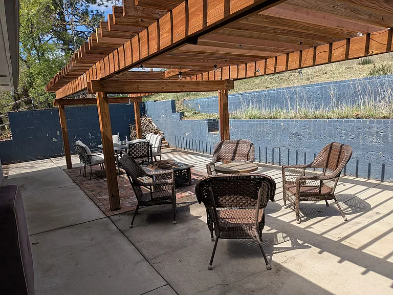 Large patio with several seating areas is accessible from the Dining Room, the Kitchen and the Master Bedroom