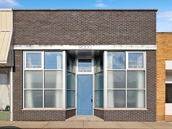 Brick storefront on brick paved St. Commercially zoned but used as a vacation rental named Skyway.