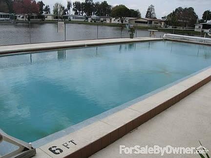pool behind club house
						:
						pool has a deck behind that is used for fishing in well stocked pond
