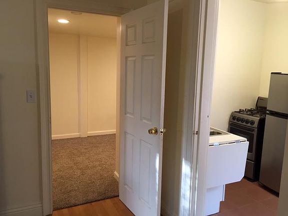 Small bedroom with storage and washer/dryer