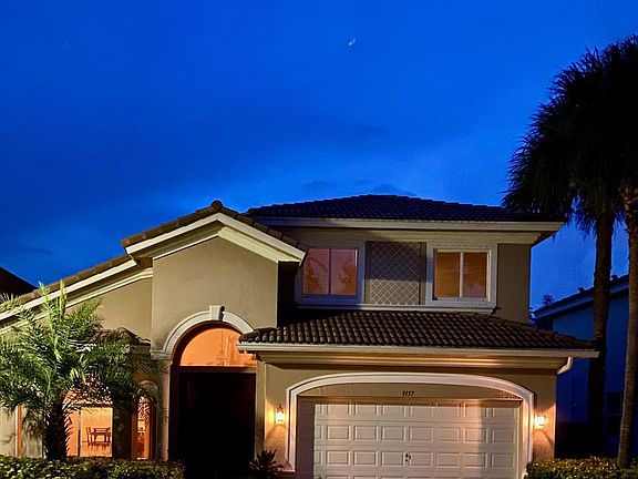 a very well lit front yard greets you during evening-night time arrivals