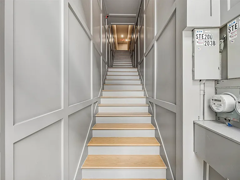 Stairs leading to units on 2nd floor.