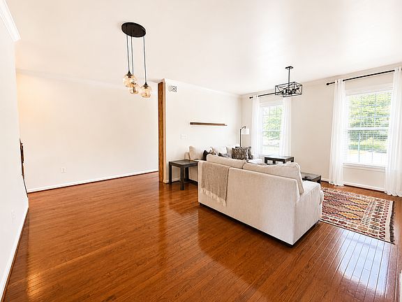 Bright, Spacious Living Room with Comfortable Sofa Seating