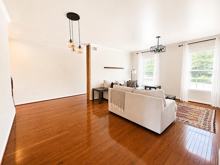 Bright, Spacious Living Room with Comfortable Sofa Seating