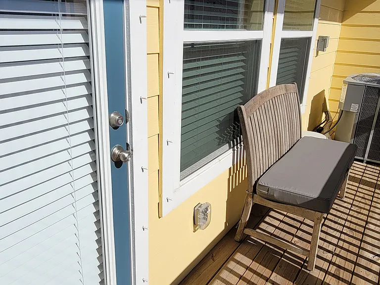 Downstairs bedroom has a balcony facing the bay