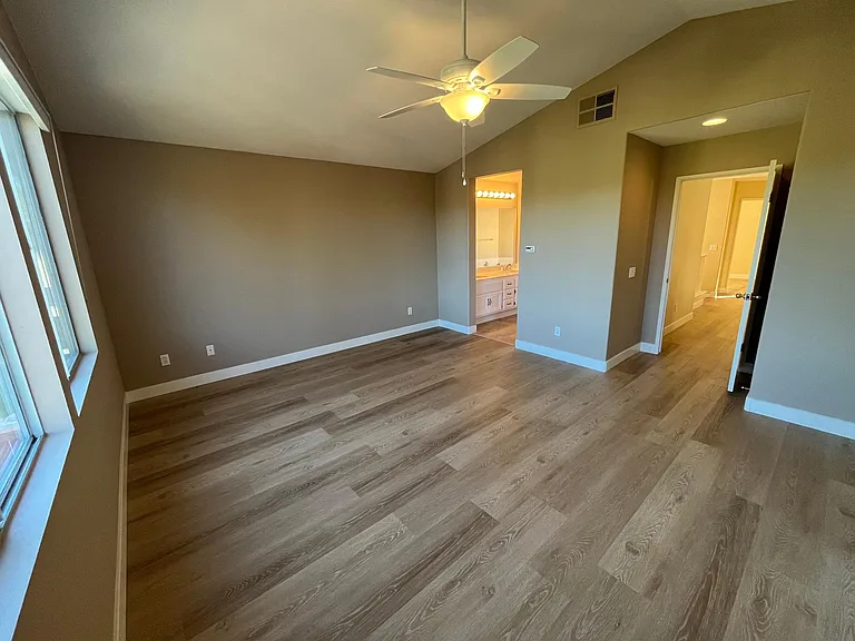 Spacious master bedroom with high ceilings